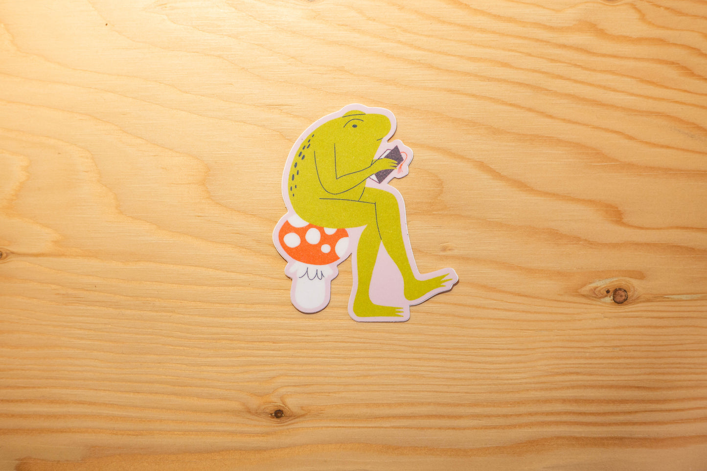 Autocollant grenouille lisant